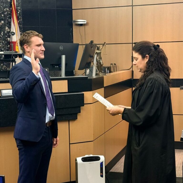 Matthew B. Rubin takes the oath during his Florida Bar swearing-in ceremony in a courtroom, marking the start of his legal career as an attorney.